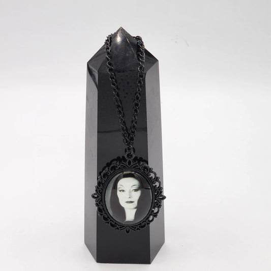 Black Morticia Addams Necklace Displayed on a Black Crystal Tower