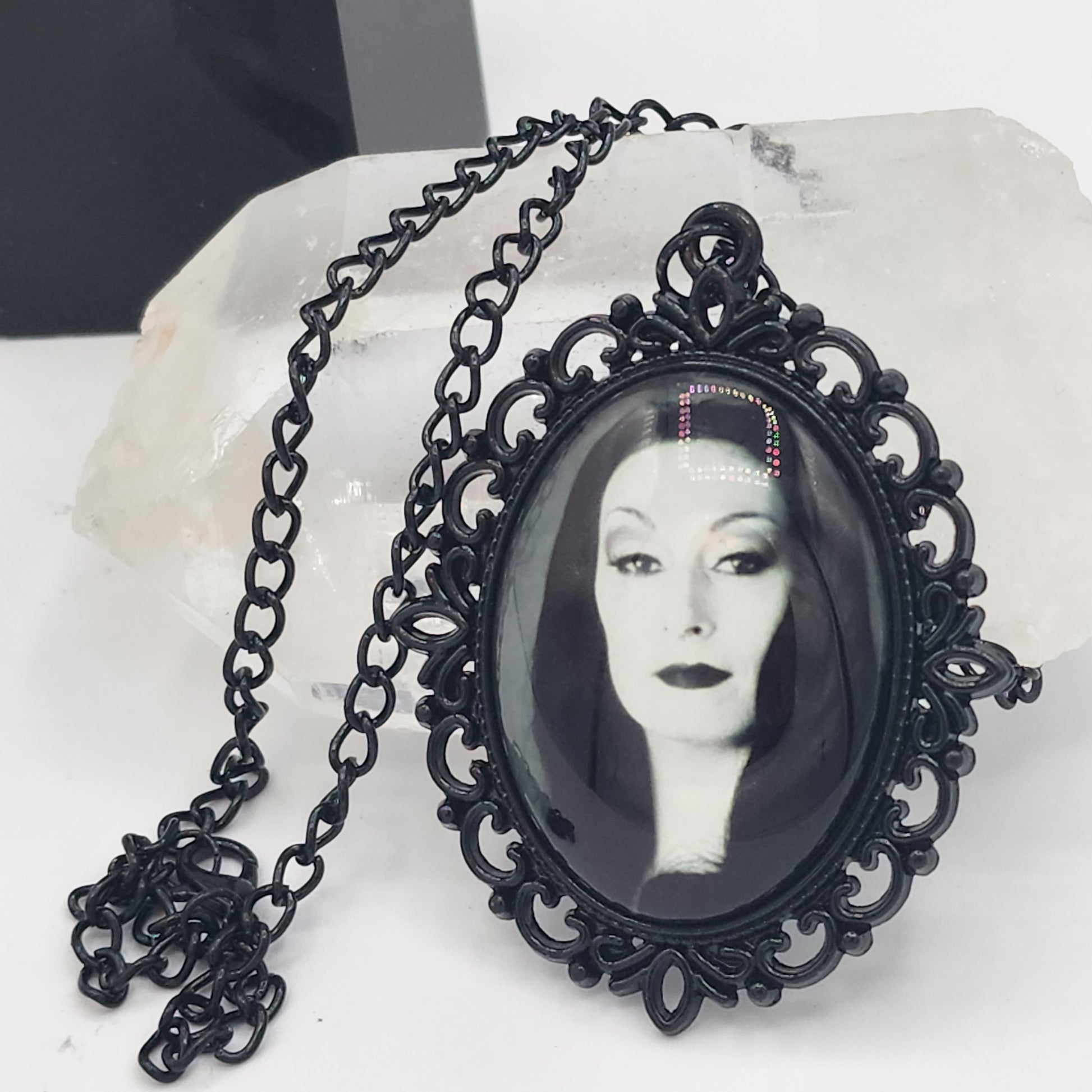 Morticia Addams Necklace Next to a Crystal Tower